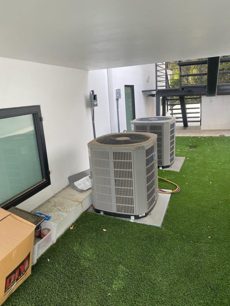 Air conditioning units installed outside a modern residential building in Los Angeles.