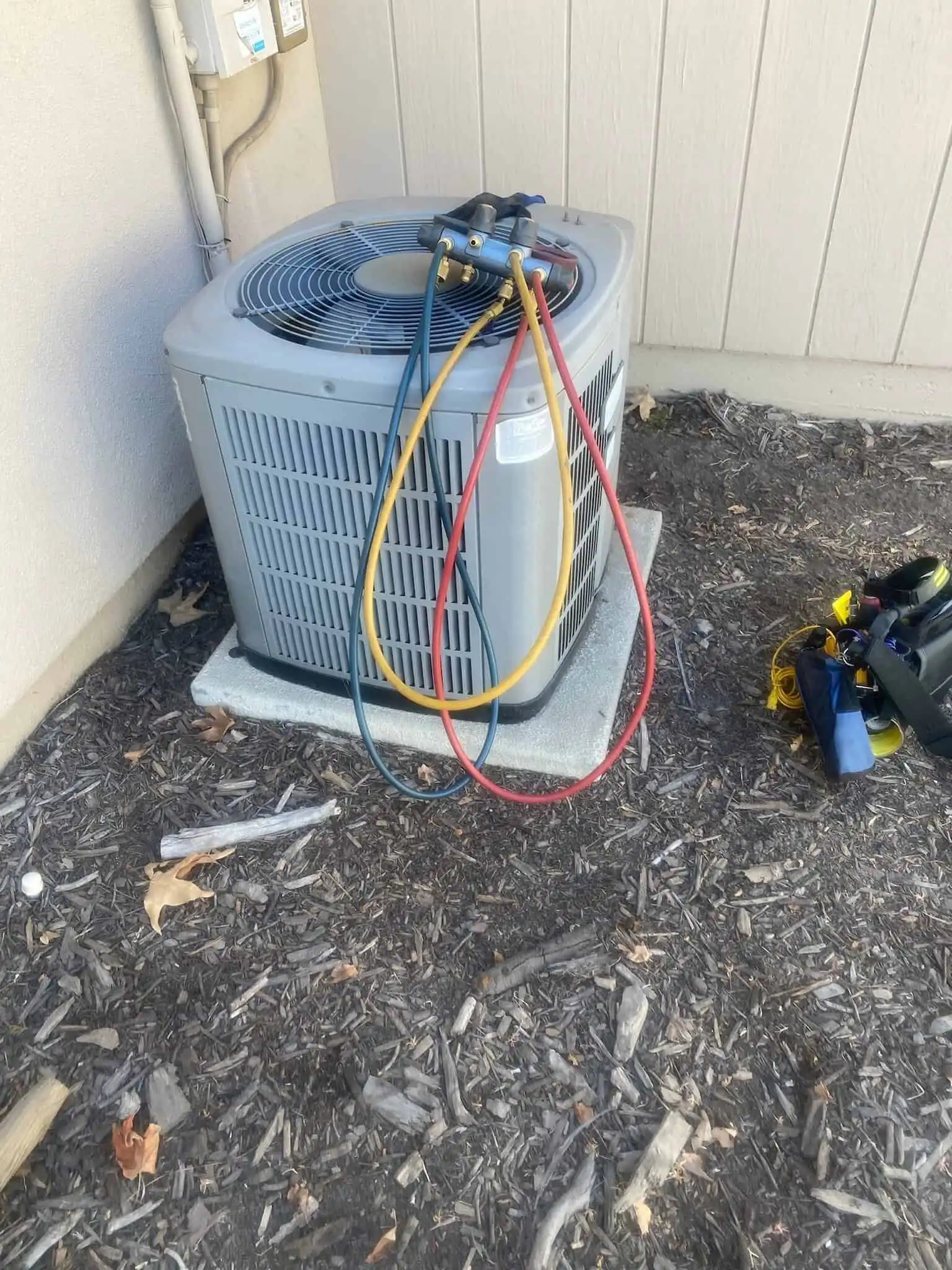 HVAC air conditioning unit with refrigerant gauges attached in Los Angeles.