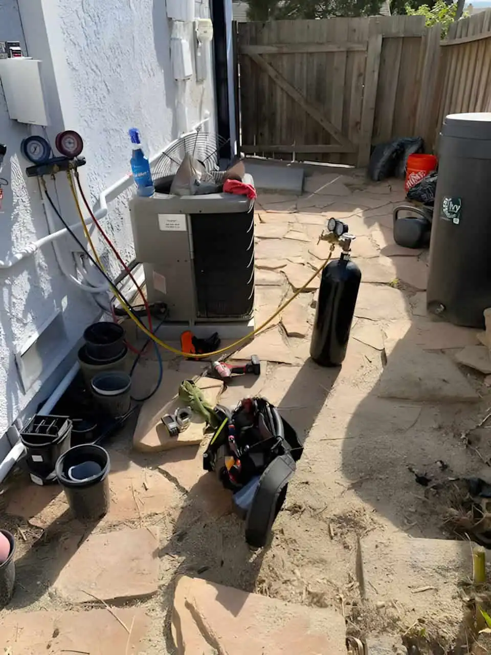 HVAC technician performing AC repair on an outdoor air conditioning unit in Los Angeles.