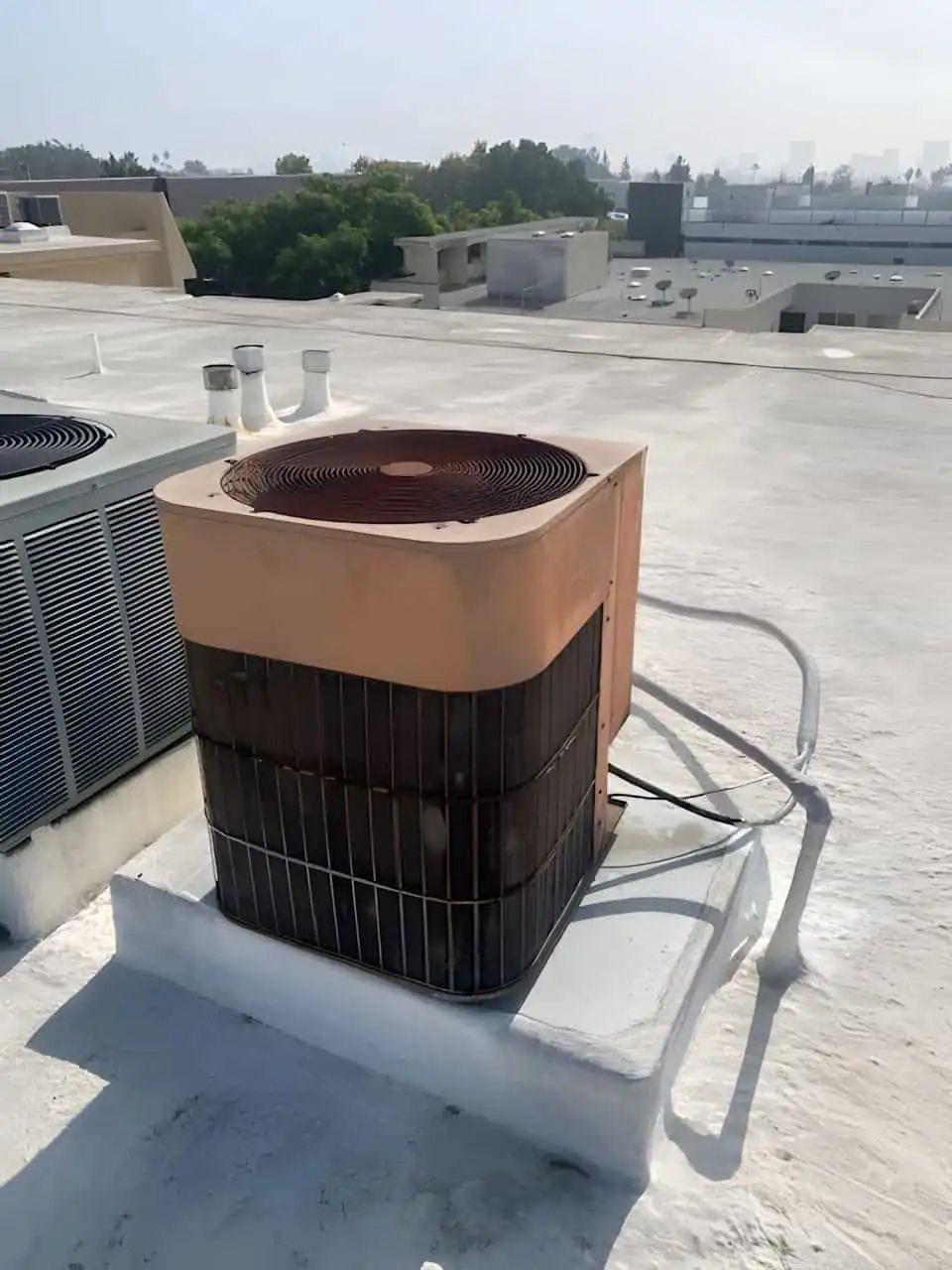Old rooftop air conditioner unit in Los Angeles ready for HVAC replacement