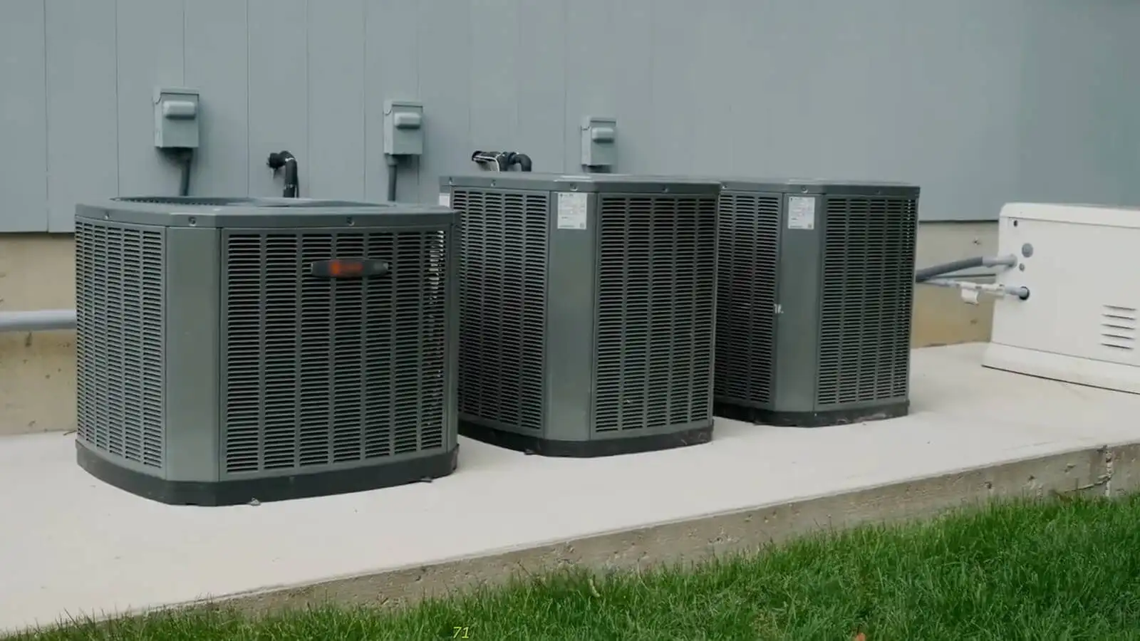 High-efficiency central HVAC outdoor units installed outside a Ventura County home.