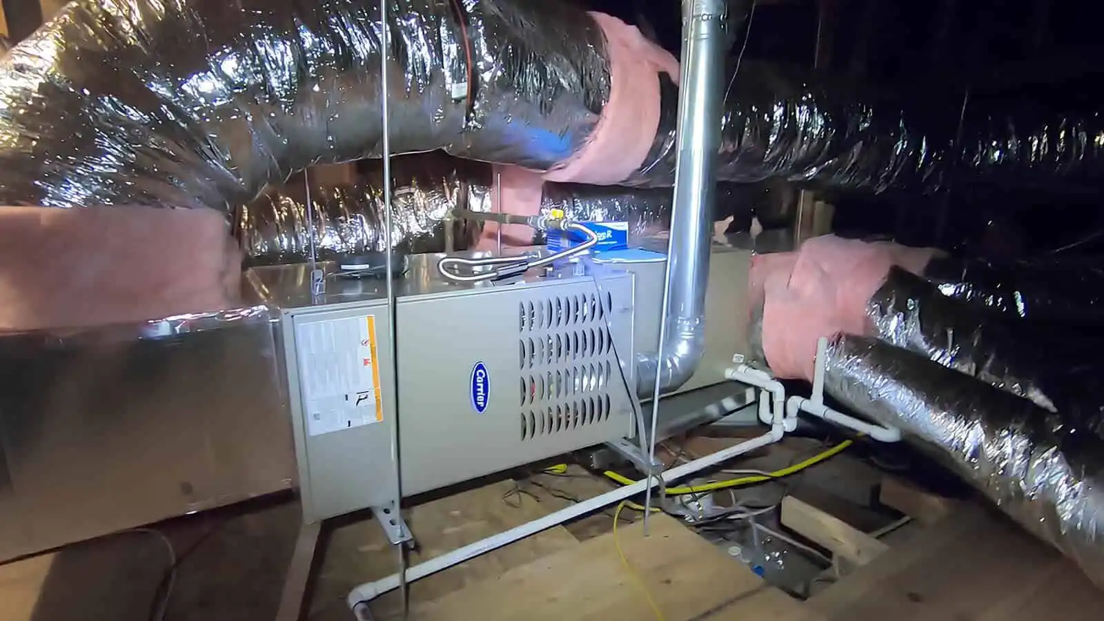 Furnace installation with ductwork in a basement HVAC system setup.