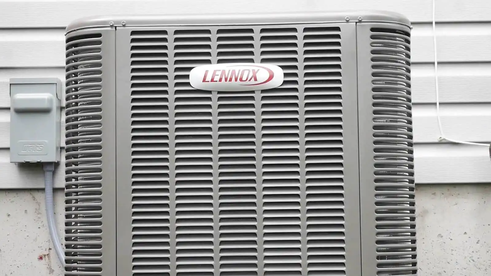 LENNOX HVAC outdoor unit with protective grille and electrical connections.