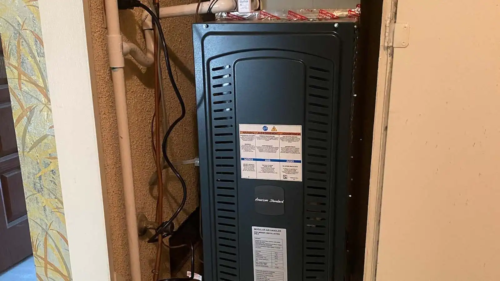A clean, professionally installed indoor air handler after an AC service